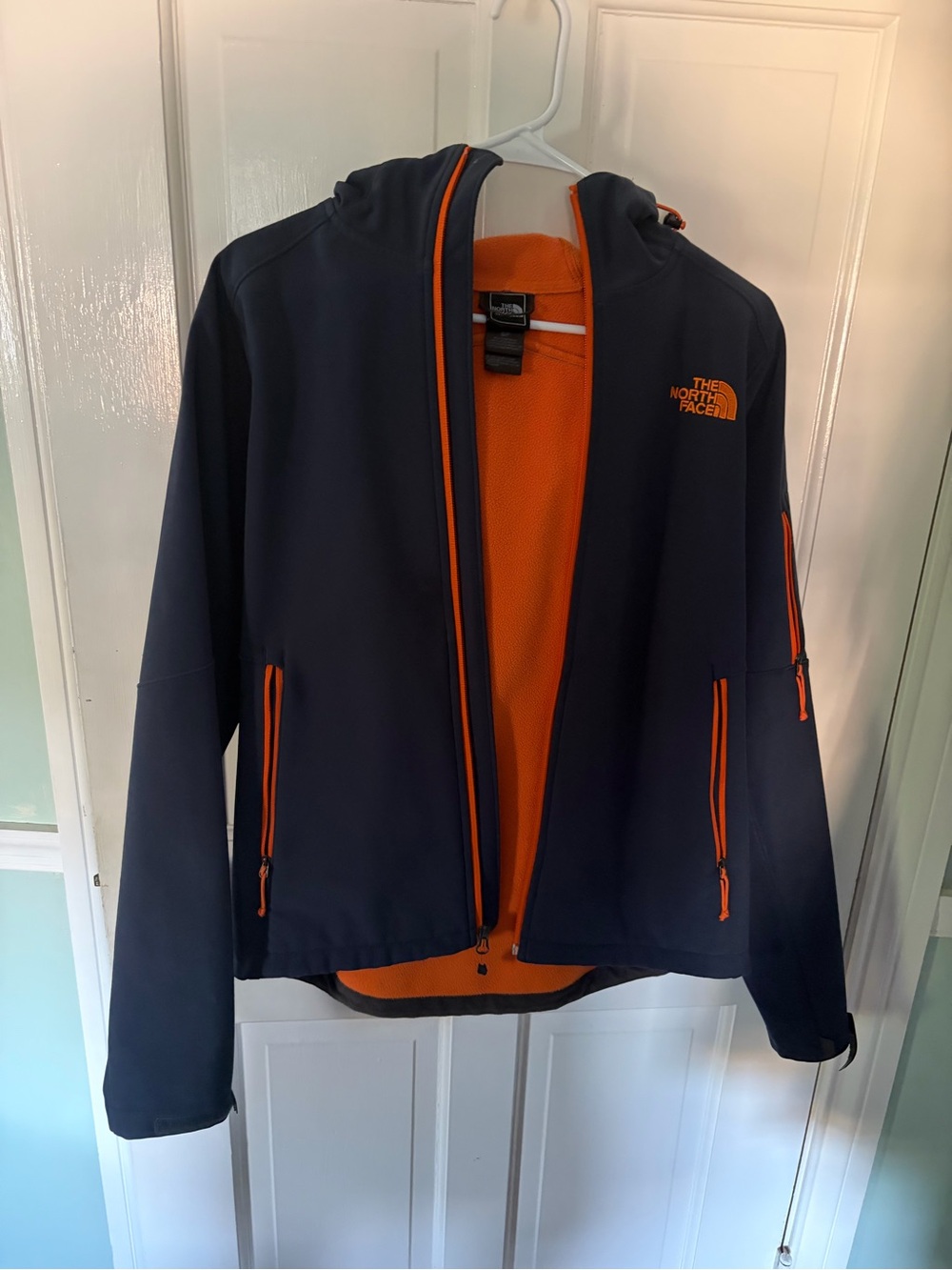 The North Face Navy Jacket with Orange Trim and Lining